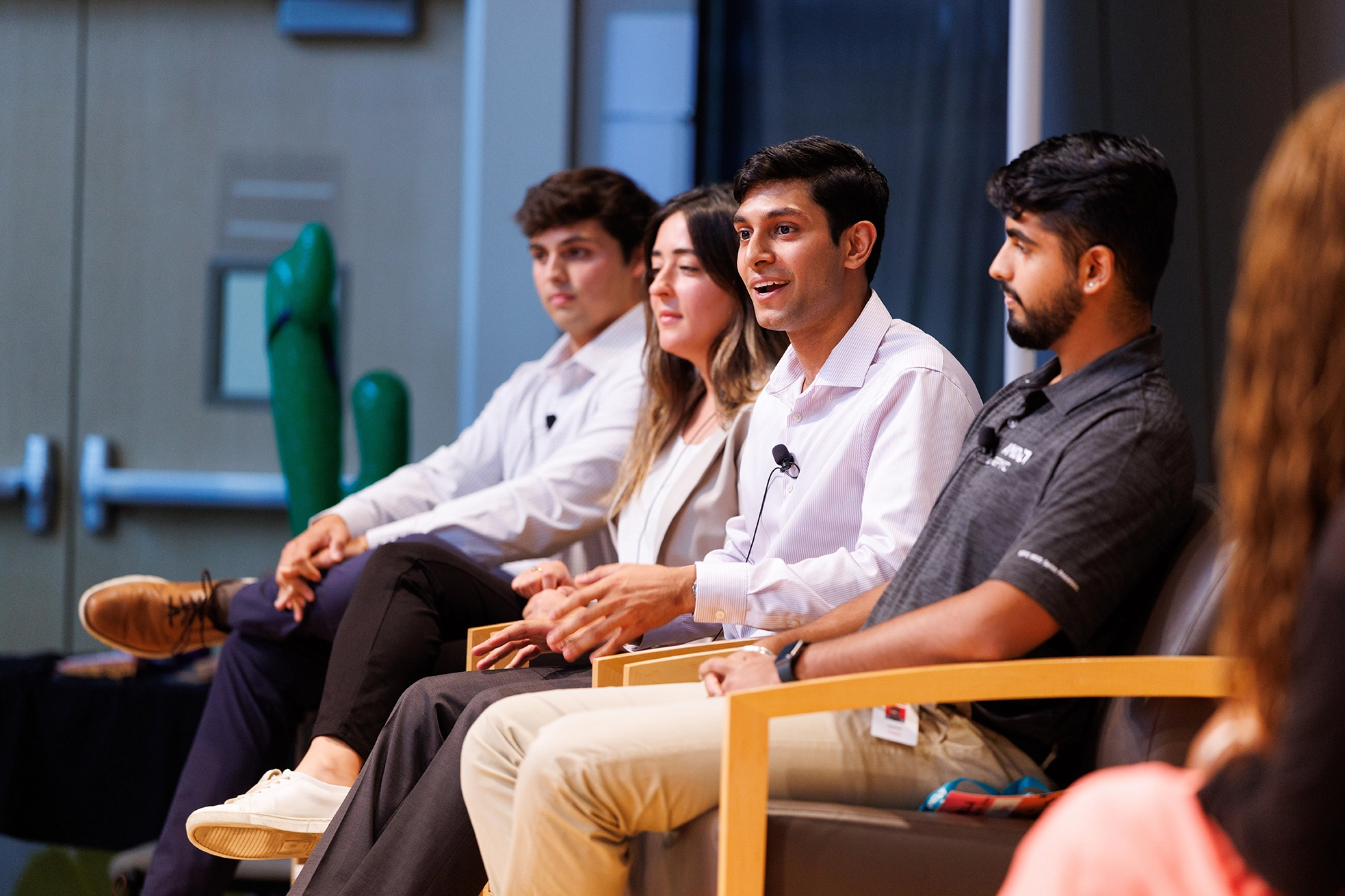 A panel of 4 individuals. One is speaking.