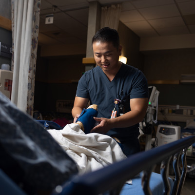 a person in a scrubs holding a doll