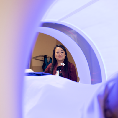 a person standing in a ct scan machine