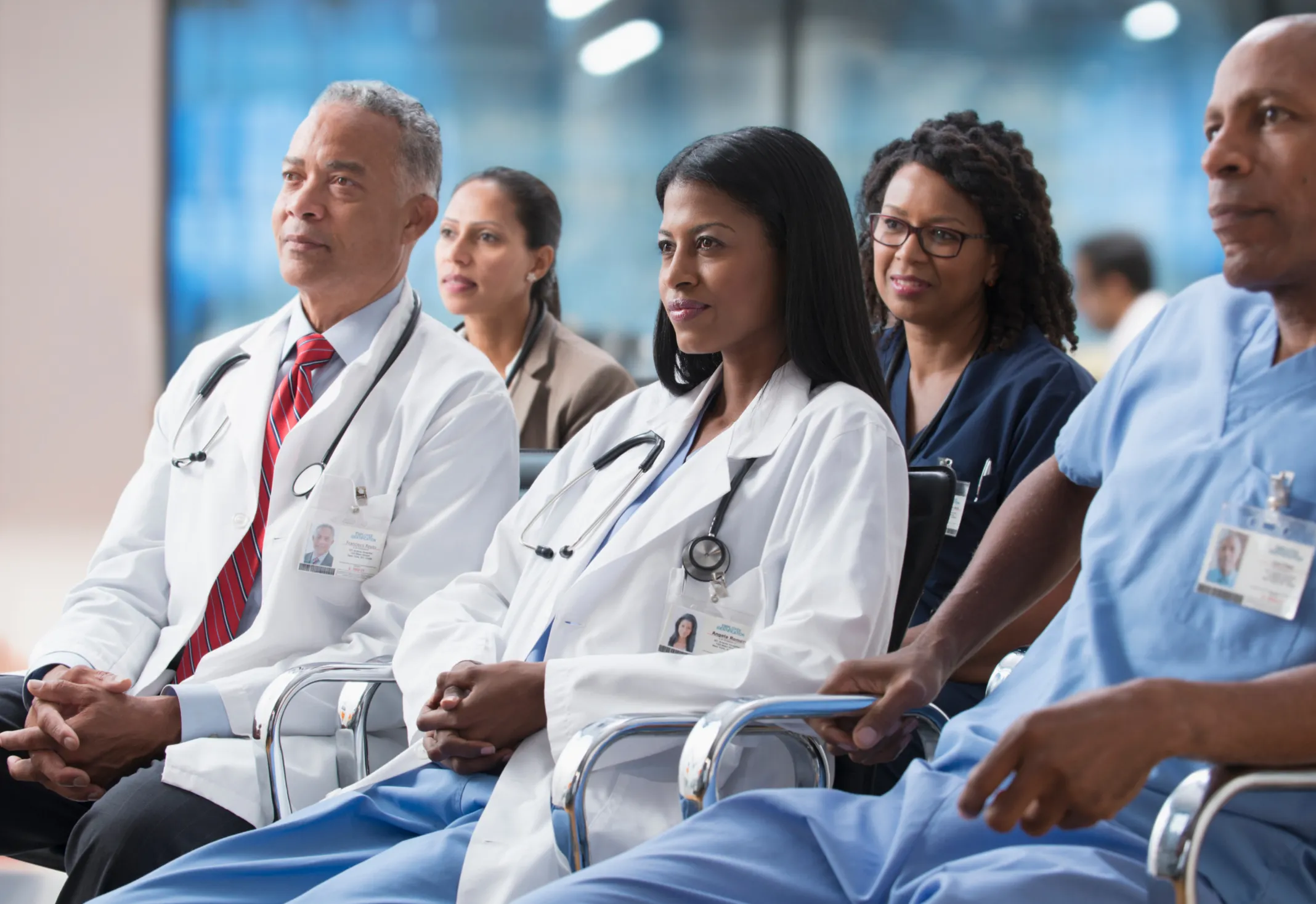 A group of providers listen intently to a lecture