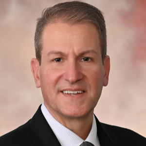 Professional headshot of Riverside Healthcare President and CEO Phil Kambic.