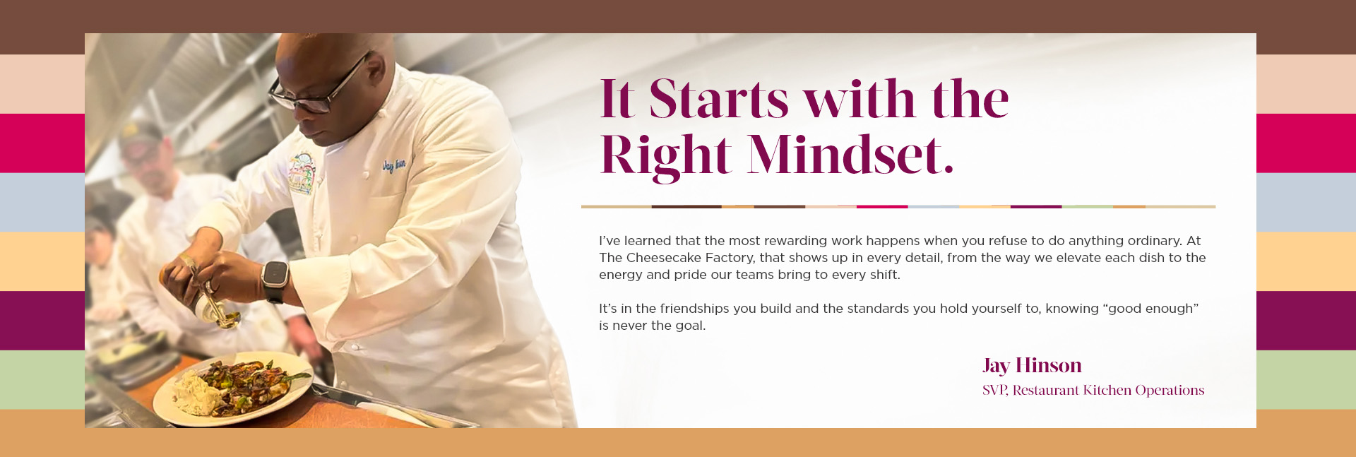 A female kitchen manager sitting, smiling in her chef coat.